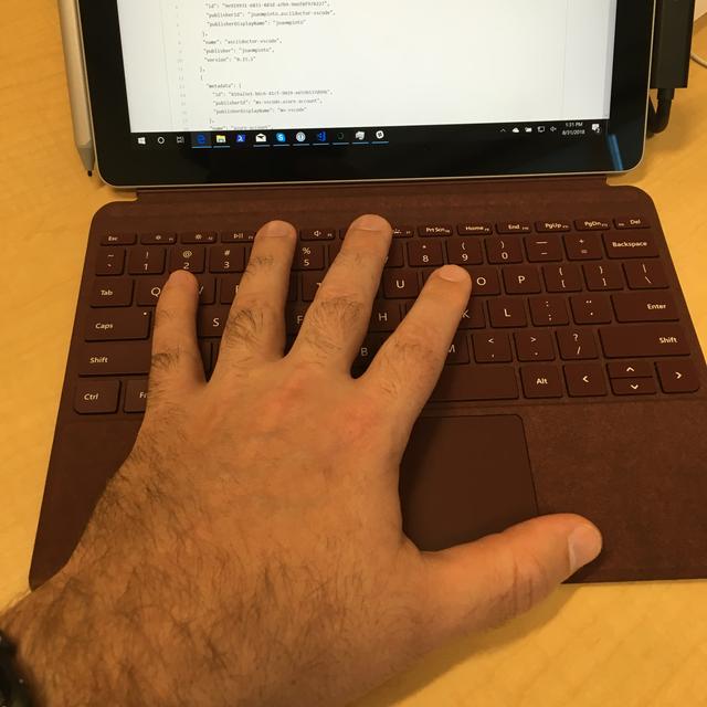 My hand on the Surface Go keyboard